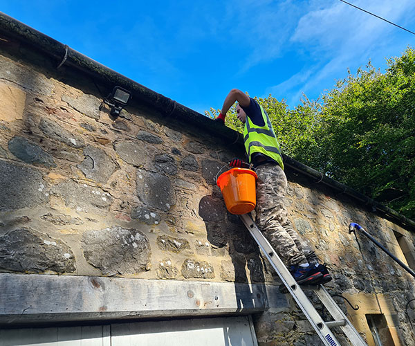 Gutter cleaning service on a Crieff property